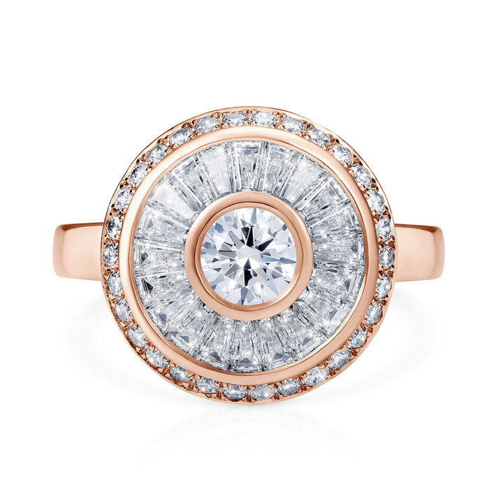 Sarah May Jewellery Happy Pod ring in rose gold, shown from face on. Ring features a large centre diamond surrounded by a thin rose gold circle, then a circular row of bagguet diamonds, another thin row of rose gold and then a final circular band of smaller diamonds.