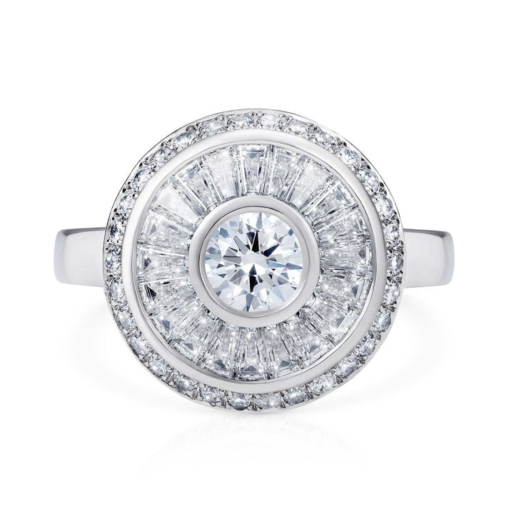 Sarah May Jewellery Happy Pod ring in white gold, shown from face on. Ring features a large centre diamond surrounded by a thin white gold circle, then a circular row of bagguet diamonds, another thin row of white gold and then a final circular band of smaller diamonds.
